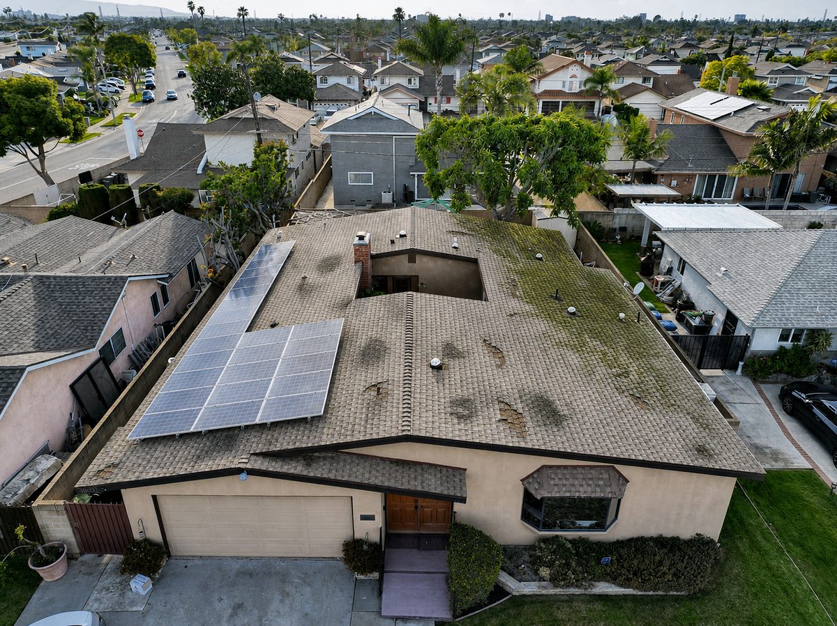 Before: Worn asphalt roof